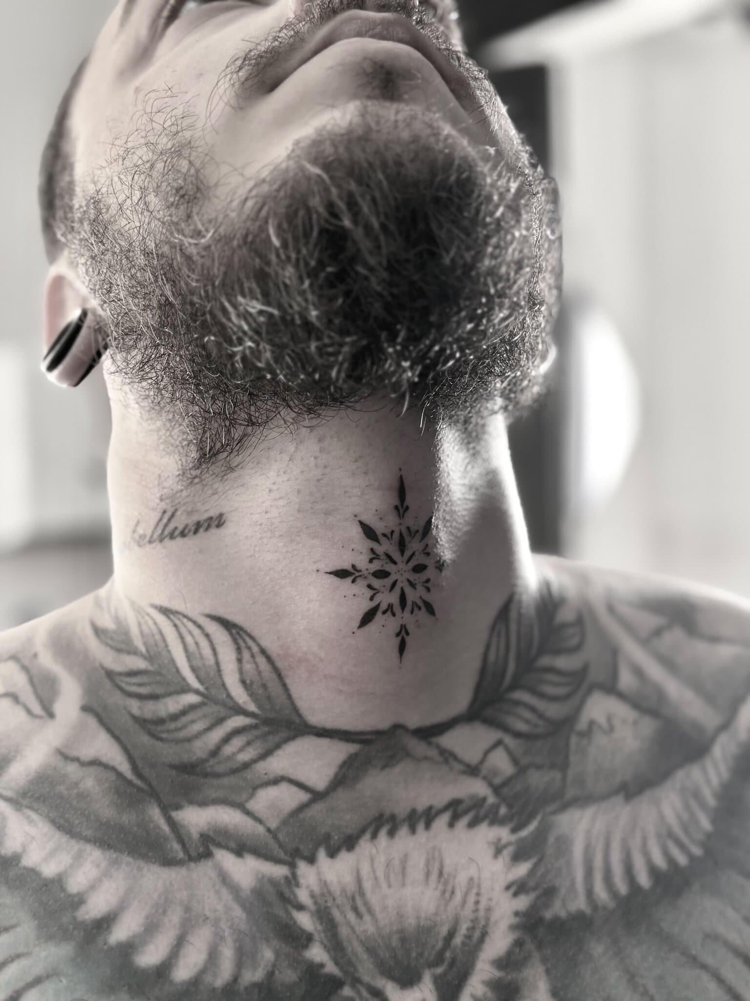 Ornamental mandala on the neck, blackwork close-up — by Stefan Buttigieg